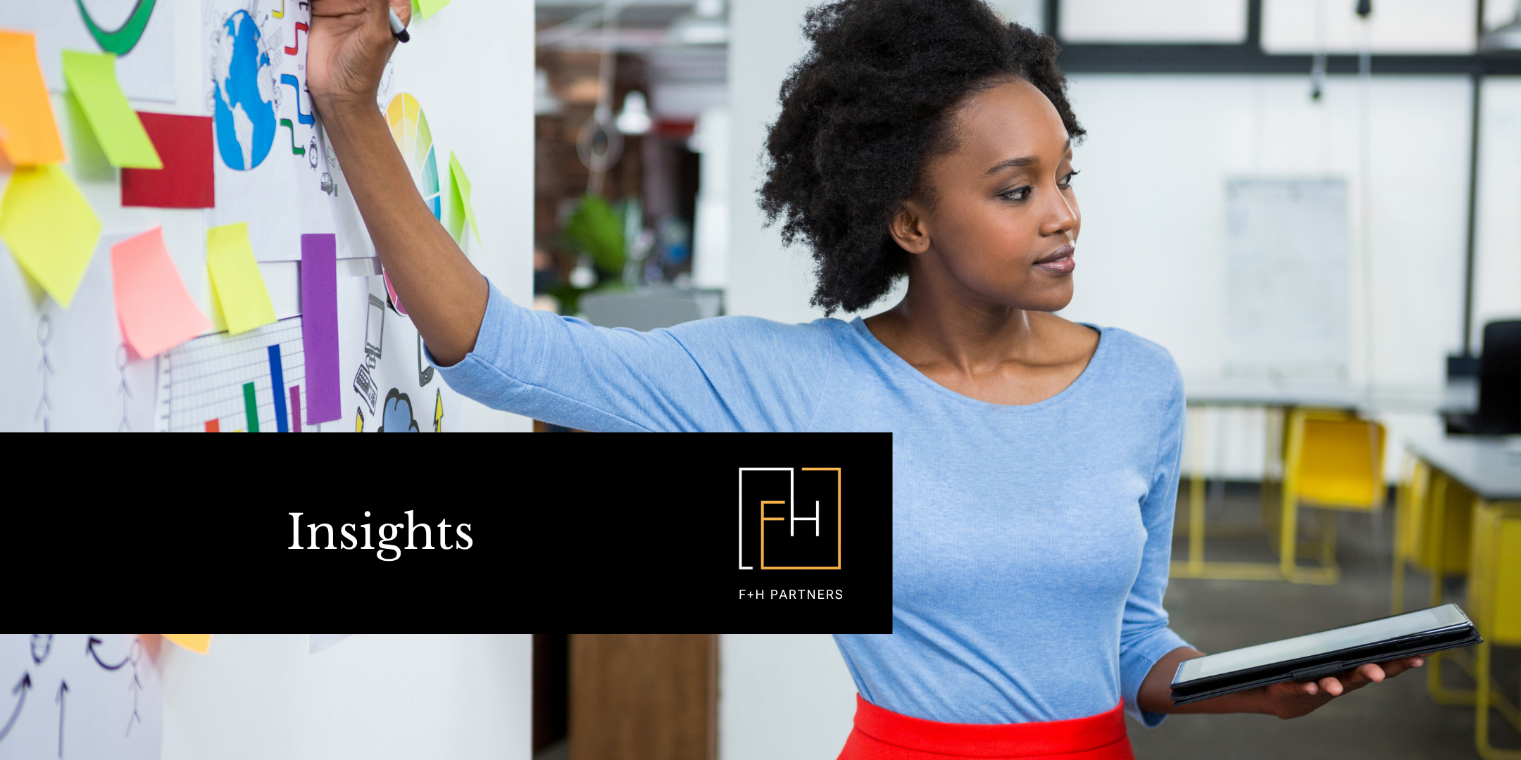 Professional woman reviewing charts and sticky notes on a wall while holding a tablet in a modern office, representing strategic planning and fundraising insights for nonprofit campaign stages.